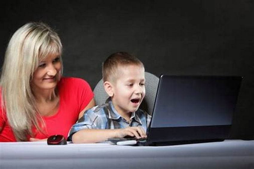 parent with child at computer